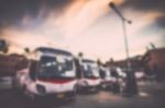 Blurred Of Many Bus In The Parking Stock Photo