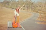 Hippie Girl Hitchhiking Stock Photo