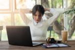 Young Businesswoman Working In Coffee Shop Stock Photo