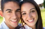 Young Couple Having Fun In A Park Stock Photo