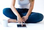 Young Woman At Home With Digital Tablet. Isolated On White Stock Photo