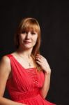 Beautiful Young Woman In A Red Dress Stock Photo