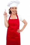 Female Chef with pointing up Stock Photo