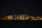 Night Public Park In The City With Houses Near Stock Photo