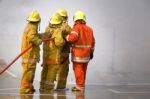 Fireman. Firefighters Fighting Fire During Training Stock Photo