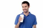 Smiling Man Holding Cold Beverage Stock Photo