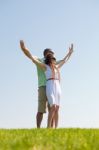 Young Couple Stretching Hands Stock Photo