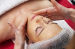 Woman Having Facial Mask At Beauty Salon Stock Photo