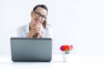 Woman With Laptop Working At Home Stock Photo