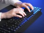 Woman Hand Typing On Keyboard Stock Photo