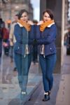 Pretty Young Girl Standing At Shopfront Stock Photo