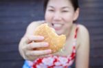 Woman Eating A Hamburger Stock Photo