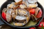 Fresh Clams On An Iron Skillet Stock Photo