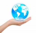 Hand Holding Crystal Globe Stock Photo