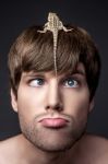 Portrait Of A Young Handsome Man With Lizard On His Face Stock Photo