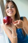 Beautiful Woman With Red Apple At Home Stock Photo