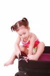 Little Girl In A Suitcase Stock Photo