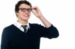 Schoolboy Adjusting His Eyeglasses Stock Photo