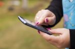 Smartphone In Hands Stock Photo