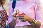 Young Girl Using His Mobile Phone In The Street Stock Photo