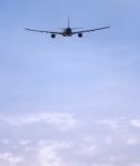 Airplane Flying In Sky Stock Photo