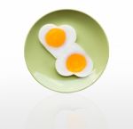 Fried Egg Heart On Green Dish Stock Photo