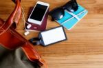 Travel Bag And Blank Tag On Wood Table Stock Photo