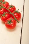 Fresh Cherry Tomatoes On A Cluster Stock Photo