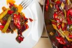 Fried Chili Pepper And Vegetable On A Wok Pan Stock Photo