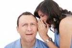 Beautiful Brunette Woman Whispering Into Her Boyfriends Ear Stock Photo