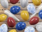 Easter Eggs And Bird Feathers On Wood Background Stock Photo