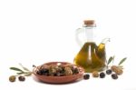 Green And Black Olives With Olive Oil Bottle Stock Photo