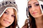 Two Young Friends Wearing Woolen Cap And Looking At Camera Stock Photo