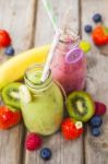 Fresh Blended Fruit Smoothies In Vintage Milk Bottles Stock Photo