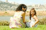 Mother Resting With Daughter Stock Photo