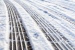 Car Tire Tracks In Snow Stock Photo