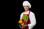 Handsome Chef Holding Vegetables Bowl Stock Photo