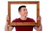 Man Holding Wooden Picture Frame Stock Photo