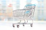 Shopping Cart On A White Table Stock Photo