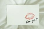 Sexy Red Lipstick Kiss 'love You' Heart On White Note On White Bed Pillow Sheet In The Morning Light, Valentine's Day Stock Photo