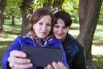 Young Woman With Her Mother Taking Pictures Of Themselves Stock Photo