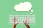 Hand On Keyboard With Cloud Stock Photo