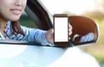 Close-up Phone In Woman Hand Showing Blank Screen Sitting In Car Stock Photo