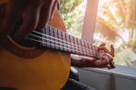 Acoustic Guitar Guitarist Playing. Musical Instrument With Perfo Stock Photo