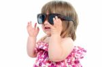 Smiling Toddler Wearing Sunglasses Stock Photo