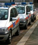 Line Of Police Cars In England UK Stock Photo