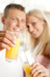 Couple Drinking Orange Juice Stock Photo