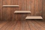 Three Brown Shelves On Wooden Interior Texture Background Stock Photo