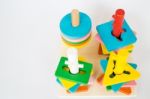 Colorful Puzzle Wooden Toy On White Table Stock Photo