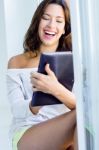 Woman With Tablet At Home Stock Photo